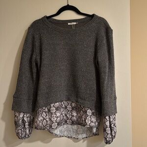 Maude vivante sweater with layered snakeskin detail on bottom and sleeves